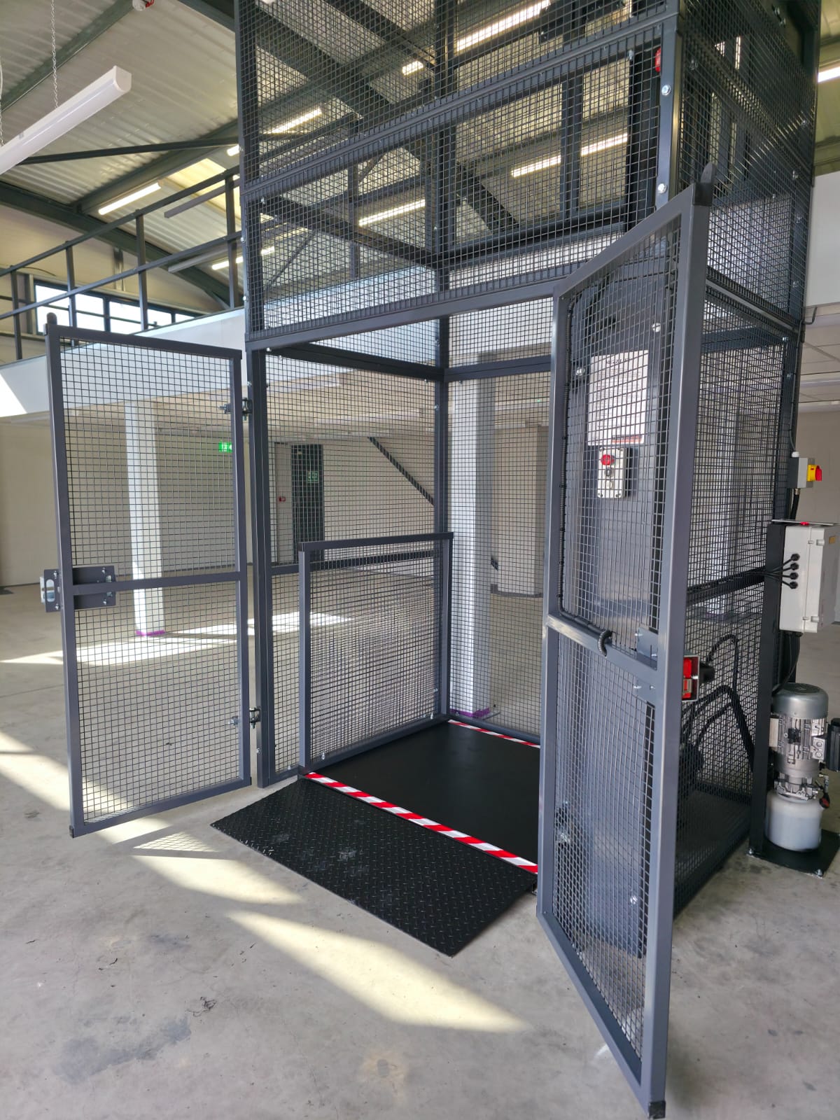 Abstract digital art featuring geometric shapes and lines layered in varying shades of green, with horizontal lines creating a textured effect across the entire image.